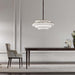 Large, modern wall sconce with a rectangular, metallic frame, angled view.