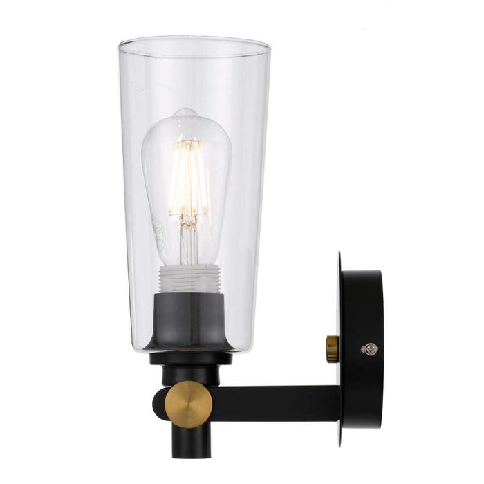 Black outdoor wall sconce with a clear glass panel, illuminated.