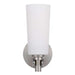 Nickel outdoor wall sconce with an opal glass panel, illuminated.