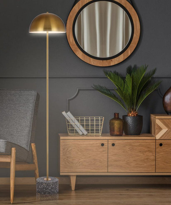 Black floor lamp with a dome-shaped shade and a black terrazzo base, cropped view.