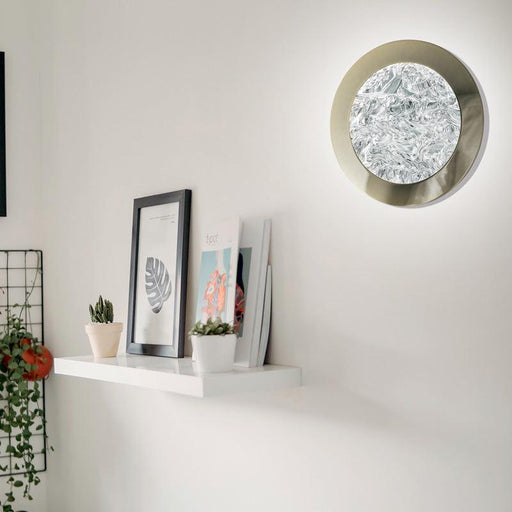Large, modern wall sconce with a rectangular, metallic frame and a central light bar.
