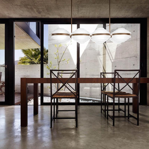 Large, modern wall sconce with a rectangular, metallic frame and a central light bar.