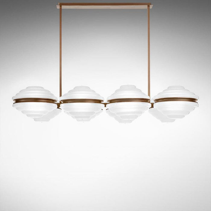 Large, modern wall sconce with a rectangular, metallic frame, in a contemporary setting.