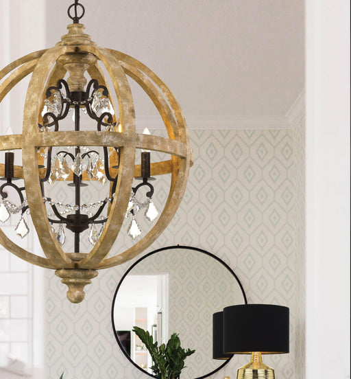 White five-light pendant with conical shades, illuminated.