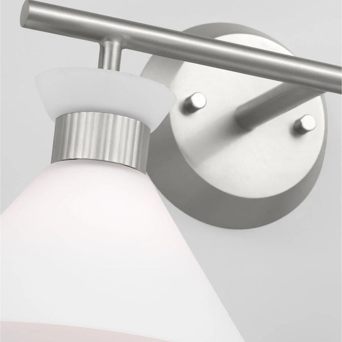 A close-up of a brushed steel circular flush mount light showing the diffuser.