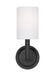 A large circular flush mount ceiling light with a matte black finish and a white diffuser.
