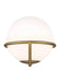 Distressed black and brass modern wall light with a cylindrical clear glass shade, angled view.