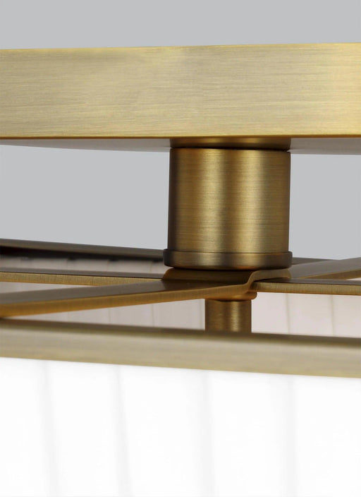 Textured white and brass modern floor lamp with a bell-shaped shade, detailed view.