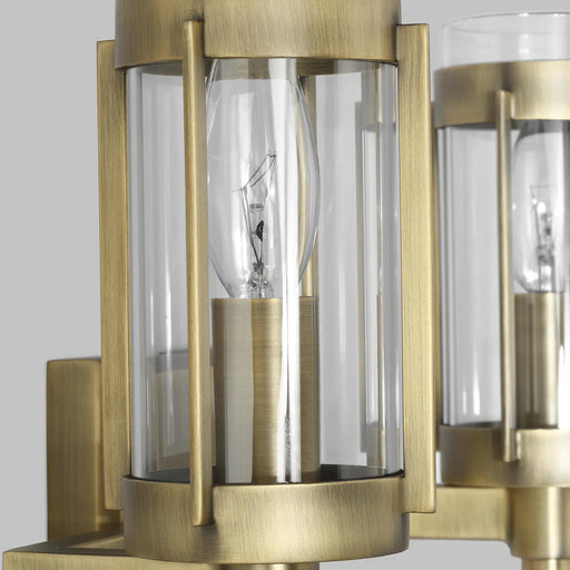 A close-up of a modern semi-flush mount light highlighting its distressed white bronze rings.