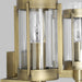 A close-up of a modern semi-flush mount light highlighting its distressed white bronze rings.