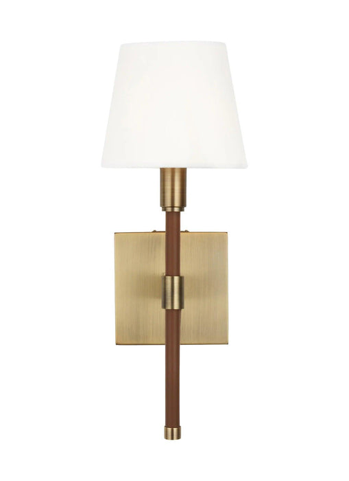 Textured white and brass wall light with a wide dish shade, side view.