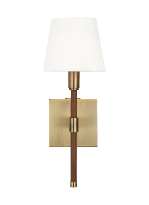 Textured white and brass wall light with a wide dish shade, side view.