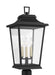 A modern outdoor wall light with a textured black finish and a clear seeded glass panel.