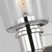 An angled view of a modern polished nickel circular flush mount light.