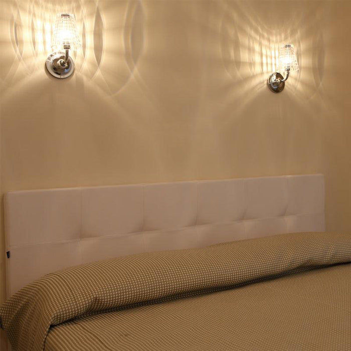 Large, modern wall sconce with a rectangular, metallic frame, angled view.
