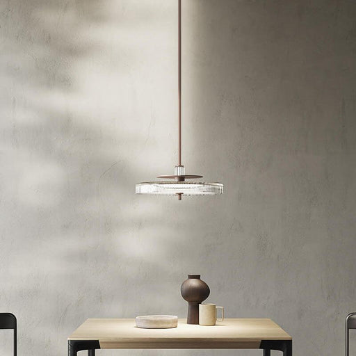 Large, modern wall sconce with a rectangular, metallic frame and a central light bar.
