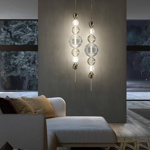 Large, modern wall sconce with a rectangular, metallic frame and a central light bar.