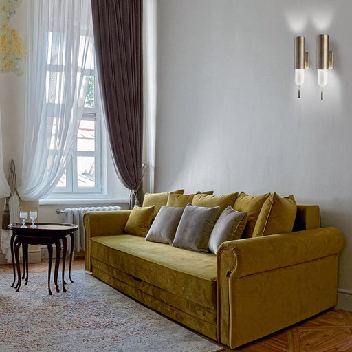 Large, modern wall sconce with a rectangular, metallic frame, angled view.