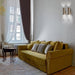 Large, modern wall sconce with a rectangular, metallic frame, angled view.