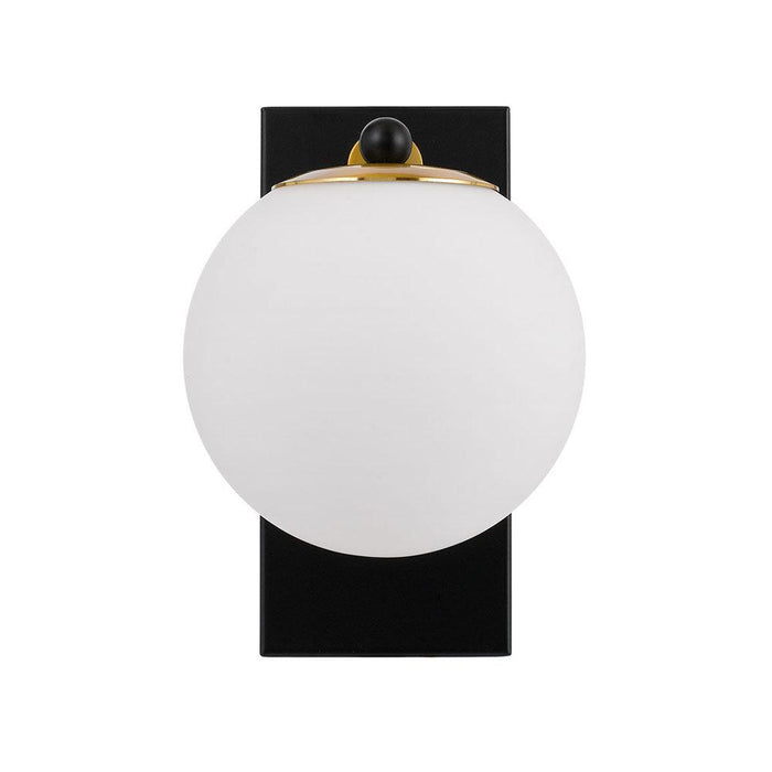 Black outdoor wall sconce with upward/downward light, illuminated.