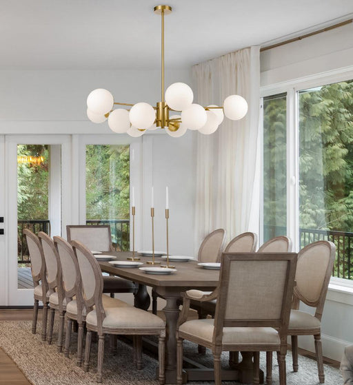 Aged gold pendant light with an opal glass diffuser, cropped view.