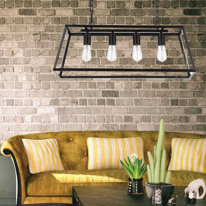 Oil-rubbed bronze pendant light with four clear glass shades, illuminated.