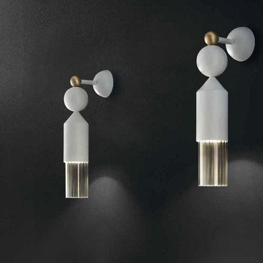 Large, clear glass pendant light with a unique, organic shape.