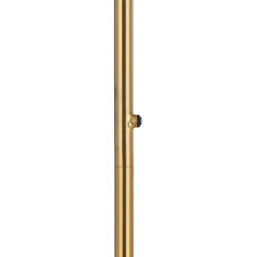 Close-up of the switch on an aged gold floor lamp with a marble base.
