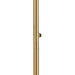 Close-up of the switch on an aged gold floor lamp with a marble base.