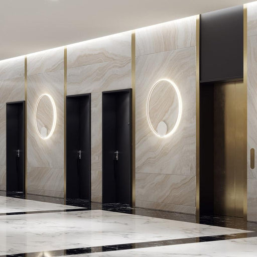 Large, modern wall sconce with a rectangular, metallic frame and a central light bar.