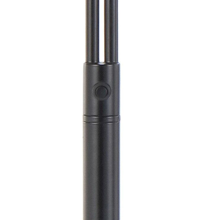 Close-up of the switch on a black floor lamp.