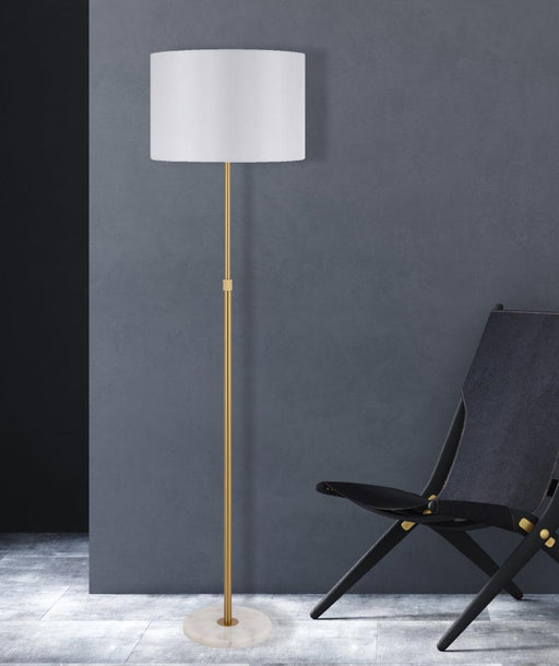 Aged gold and ivory floor lamp with a conical fabric shade, cropped view.