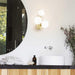 Large, modern wall sconce with a rectangular, metallic frame and a central light bar.
