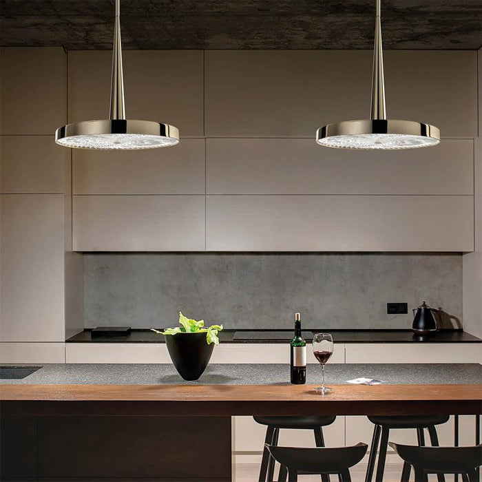 Large, modern wall sconce with a curved, metallic body and upward/downward light.