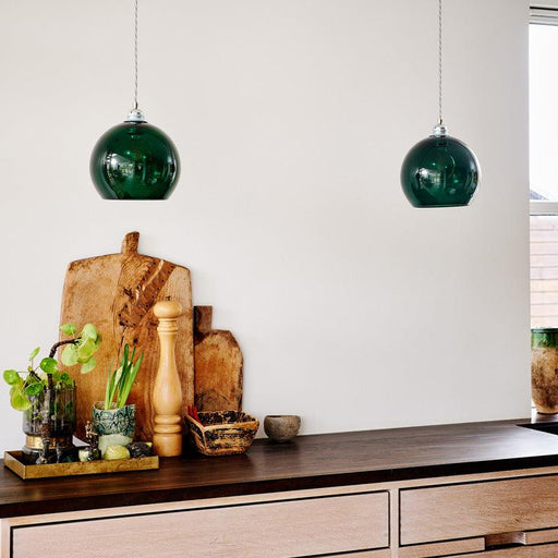 Chrome modern chandelier with multiple crystal rods, angled view.