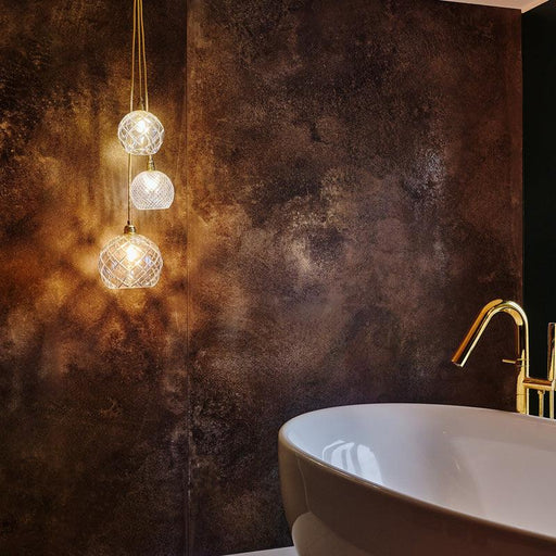 Large, modern chandelier with crystal accents and a metallic frame.