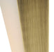 Aged bronze outdoor wall sconce with a rectangular shape and a clear glass panel, illuminated.