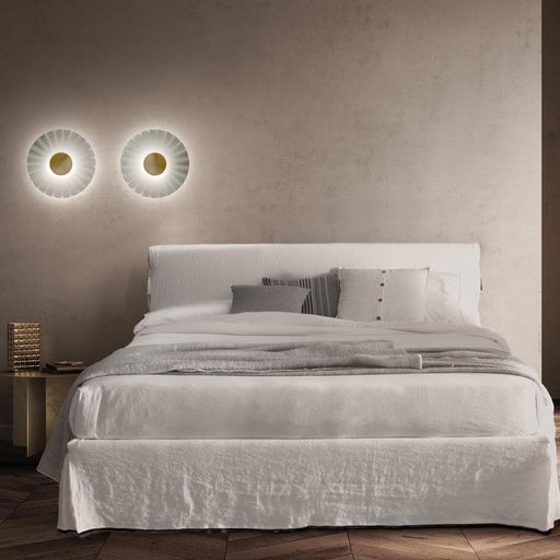 Large, modern wall sconce with a rectangular, metallic frame and a central light bar.