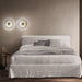 Large, modern wall sconce with a rectangular, metallic frame and a central light bar.