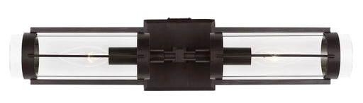 An overhead view of a modern polished nickel semi-flush mount light with a white dome.