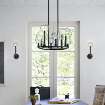 An angled view of a modern black outdoor wall lantern.