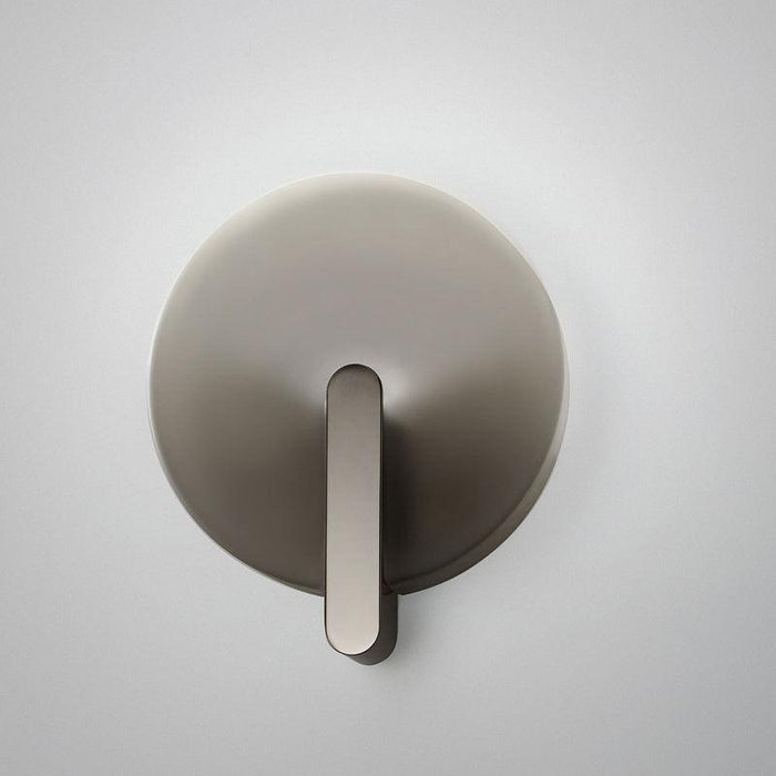 Large, modern wall sconce with a rectangular, metallic frame, side view.