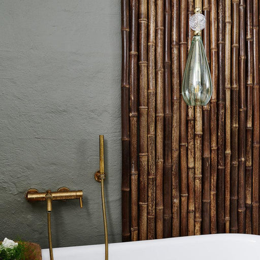 Large, modern wall sconce with a rectangular, metallic frame, angled view.