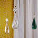 Large, modern wall sconce with a rectangular, metallic frame, side view.