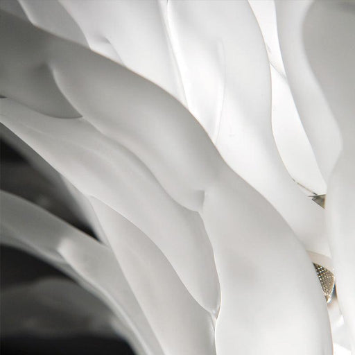 Large, decorative wall art with a textured, floral pattern, angled view.