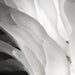 Large, decorative wall art with a textured, floral pattern, angled view.
