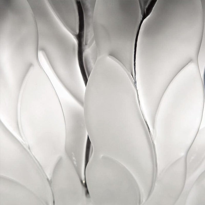 Large, decorative wall art with a textured, floral pattern, close-up of texture.