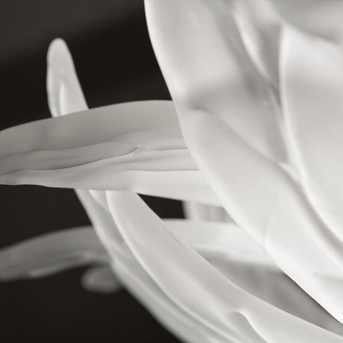 Large, decorative wall art with a textured, leaf-like pattern, close-up of texture.