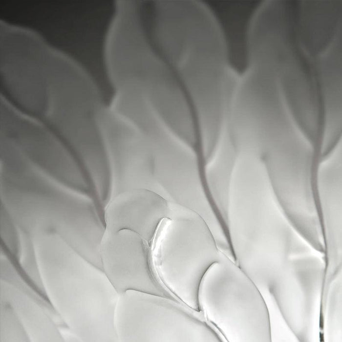 Large, decorative wall art with a textured, leaf-like pattern, side view.