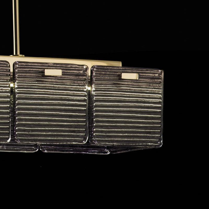 Large, modern wall sconce with a rectangular, metallic frame, side view.